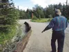 Bruce Derstine walks along earthworks in his driveway. Derstine faces six citations from borough officials for constructing earthworks he says are meant to protect his property. The first two