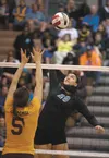 Leiah Reichel goes for the kill during quarterfinal competition against the Dimond Lynx Thursday at the ASAA/First National Bank State Volleyball Championships at Chugiak High School. ROBERT 