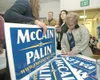 ROBERT DeBERRY/Frontiersman McCain/Palin political signs are
handed out Friday at a Republican Party fundraising rally at Best
Western Lake Lucille Inn in Wasilla. Gov. Sarah Palin did not
at