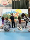 Elementary students work on one of the mural paintings as part of a collaborative art and music project. Students from Willow, Talkeetna, and Trapper Creek have been hard at work creating the