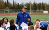 Palmer High head coach Rod Christiansen holds a game ball given to him by his team to commemorate his 150th career win as head coach. With a 35-8 victory over Eagle River Saturday, Sept. 16, 