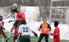 Colony junior Sullivan Menard goes up to battle an East Anchorage player for possesion during an 8-0 win over the Thunderbirds Wednesday at Colony High School. JEREMIAH BARTZ/ Frontiersman