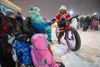 Mrs Santa on a fat tired bike handing out candy during the Colony Christmas Parade Saturday, Dec. 9, 2023. J. David McChesney/Frontiersman