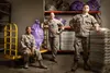 Members of the Pacific Air Forces Air Postal Squadron Detachment 4 pose for a group photo in this composite image in Sydney August 24, 2019. The detachment is responsible for delivering mail 