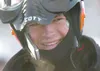 Johnny Wagner/News-Miner Nick Olstad speaks to his grandparents
over a cellular phone wedged in his balaclava after he and teammate
Todd Minnick won the 2009 Tesoro Iron Dog on Saturday after