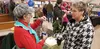 Betty Allen Sheeler accepts a gift from a friend at her table during a Small Business Saturday event at the Palmer Train Depot Nov. 24. Jacob Mann/Frontiersman