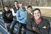 ROBERT DeBERRY/Frontiersman New Wasilla High head football coach
Kent Rilatos, front right, stands with Wasilla football players,
from left, Ryan Pomrenke, Braydon Kuiper, Tyler Anderson and 