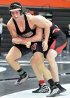 Wasilla’s Conner Minnick tries to escape from Kenai’s Dylan Carter during their match at 160 pounds at the West Christmas Classic at West High School in Anchorage on Saturday. MATT TUNSETH/Ch