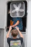 A Scottish Highland Games attendee picking up his order at the back of a food truck. J. David McChesney/Frontiersman