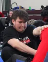 Justin Johnson from Team Yukon, flexes the tendons and ligaments of his forearms, relying on his upper body strength during the Finger Pull as part of the Dene Games at the Arctic Winter Game