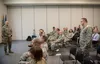 U.S. Air Force Maj. David Taylor, 673d Medical Group otolaryngologist, asks a question to U.S. Air Force Maj. Gen. Lee E. Payne, Defense Health Agency Assistant Director for Combat Support, a