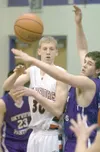 M. SCOTT MOON/Peninsula Clarion Wasilla sophomore Connor Devine
passes the ball around Skyview’s Chad Oakes early in the first
quarter Thursday during the Norhtern Lights Conference Basketbal