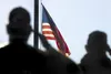 Combat Veterans Association members salute the American flag as it flies at half-mast during a Sept. 11 ceremony at the Veterans’ Wall of Honor in Wasilla last year. Today is the 11-year anni
