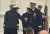 RADM Bob Little, the new commander of the Coast Guard's Arctic sector, smiles as he shakes hands with RADM Megan Dean, the departing commanding officer, during a change of command ceremony Fr