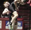 Wasilla's Berit Sturgeon lifts Colony's Levi Hopkins into the air during the 138-pound final of the North/South Invitational Saturday at Wasilla High. Hopkins edged Sturgeon 7-6 in the ultima