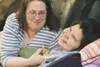 Caregiver Lorie Schmidt humors resident Sherry Francis, a
27-year-old Yu’pik Eskimo whose family placed her in state care
after she was born severely disabled. (HEATHER A.
RESZ/Frontiersman)