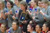 Wasilla girls head coach Jeannie Hebert-Truax (center) celebrates winning the Northern Lights Conference girls championships March 9, 2019, with her team at Soldotna High School. Photo by Joe