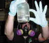 Mike Anderson, a toxicologist who works for the ECC, examines
chemical waste from a meth lab. Waste products from methamphetamine
include highly toxic chemicals that must be disposed of by tr