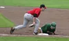 Mat-Su outfielder Elijah MacNamee slides into first under the tag of Peninsula infielder Benjamin Wanger during a 3-1 win over the Oilers in the first game of a best-of-3 semifinal playoff se