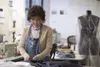 Jin Lee, Joint Base Elmendorf-Richardson Laundry seamstress, hems a pair of trousers at JBER, Alaska, Oct. 20, 2017. The JBER Laundry employs 63 airmen who collectively wash, dry, press, fold