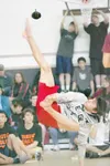 ROBERT DeBERRY/Frontiersman Wasilla junior Manny Curtis makes an
attempt at the 62-inch mark during the Alaskan High Kick event at
the Alaska Job Corps Center Native Youth Olympics competitio