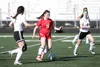 Houston midfielder Cassie Kapuniai brings the ball up the field against Colony. The Hawks stared their season with wins over Kodiak, Palmer and Lathrop. Courtesy of Bruce Eggleston/matsusport