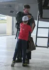 Lt. Col. Ryan Pelkola, 302d Fighter Squadron director of operations, receives a new patch from his son Aug. 7, 2021, Joint Base Elmendorf-Richardson, Alaska. Pelkola is the first F-22 Raptor 