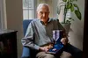 U.S. Air Force Lt. Gen. (Ret.) James D. Hughes, showcases his Purple Heart medal in Potomac Falls, Virginia, June 23, 2022. In 2006, Hughes established the National Purple Heart Hall of Honor