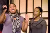 Oreanna Powell, left, and sister Shani sing for the crowd
gathered at the Martin Luther King Jr. celebration Monday at the
Valley Performing Arts Center in Wasilla. (ROBERT
DeBERRY/Frontiersm