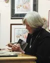 Anchorage author and illustrator Barbara Lavallee signed books,
personalized prints and joked with fans Saturday at a Town Square
Art Gallery signing. Lavallee added snowmen to her newest boo