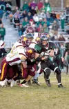 Colony senior Skye Rench gets hit by a pack of Dimond Lynx
during Friday's game at Colony High School. (ROBERT
DeBERRY/Frontiersman)