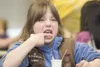 Kurstin Griste, 7, grimaces as she tastes all natural home made
toothpaste during the Girl Scouts’ annual Women of Science and
Technology Day at Mat-Su College Saturday morning. The scouts ha