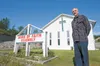 Word of Faith Assembly pastor Steve Alexander stands in front of the church along Bogard Road. Someone broke into the church office a week ago and stole a laptop computer, an iPod dock with s