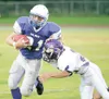 ROBERT DeBERRY/Frontiersman Palmer senior Lucas Secoy sheds
Lathrop cornerback David Richard during a 48-14 Moose win over the
Malemutes.