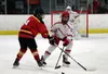 Wasilla's Mason Holler works to move the puck away from a defender during a win over West Valley. Bruce Eggleston/matsusports.net