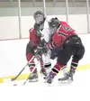 ROBERT DeBERRY/Frontiersman Colony forward Lance Nezaticky is
sandwiched between Kenai’s Dominick Eubank and Sean Dougherty
during Thursday’s game at the Curtis C. Menard II Ice Arnea.