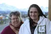 Connect Palmer Executive Director Sherry Carrington with a client outside the main office in downtown Palmer. Frontiersman file photo.