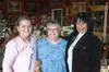 Kathy Day and Gwenn Finney, cancer survivors, smile for the camera with JoAnn Frank while at her shop ‘The Gallery,’ which was one of several Palmer merchants offering significant discounts t