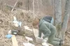TODD DISHER/Frontiersman Jason Baird measures the texture of
soil to determine its composition.