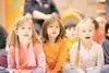 ROBERT DeBERRY/Frontiersman Pioneer Peak Elementary students,
from left, Addie Hendrickson, Brigget Wright and Lindsey Bozine
watch with amazement during a reptie demonstration Thursday
after