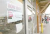 ROBERT DeBERRY/Frontiersman A “now hiring” sign hangs in the new
Sally Beauty location in the Cottonwood Creek shopping complex in
Wasilla. Alaska Wildberry Products, Subway and Game Stop hav