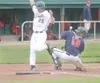 Mat-Su outfielder Kyle Jensen, left, beats the throw home to
score the Miners’ first run during a 5-4 win over the Alaska
Goldpanners at Hermon Brothers Field in Palmer on Wednesday. Jensen
t