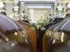 CHRIS GILLOW/Frontiersman Gallons and gallons of tasty wine
ferment and acquire flavor at Valley Winery. Customers make their
own special flavor combinations, then enjoy their labors. A typic