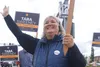 Tara Sweeney, candidate for U.S. House, waves signs in Anchorage on Aug. 16. Sweeney dropped out of the House race on Tuesday, leaving the contest largely up to Democratic former legislator M