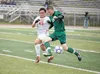 Colony’s Chris Olsen battles for the ball against Juneau’s Edric Carillo during first-round competition at the ASAA/First National Bank State Soccer Championships at Tom Huffer Sr. Stadium in