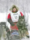 ROBERT DeBERRY/Frontiersman Mike Suprenant moves his team off
Knik Lake and into the woods Saturday during the start of the Joe
Redington Sr. Memorial Knik 200 Sled Dog Race.