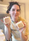 Delaney Rau, owner/operator of Delaney’s Sourdough, shows off her English muffins. The popular local microbakery will bring its goods to the May 27 Spring pop-up event that launches the weekl
