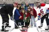 The ceremonial first puck at the Iditarod Days Hockey Classic
was dropped by Curtis Menard, Carol Menard and the children of Curt
Menard II. Photos submitted by Robert Baker/ North Star
Multi