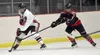 Kenai Central's Braden Smith shields the puck from Houston's Brayden Spain on Thursday, Oct. 26, 2023, at the Kenai Multi-Purpose Facility in Kenai, Alaska. Jeff Helminiak/Peninsula Clarion