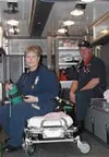 As a part of Central Mat-Su's emergency services crew, Lamb,
left, racks up hours on most weekends and often on holidays, to
give those with younger children on the force time with their
fami